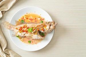 Steamed grouper fish with lime and chillies photo