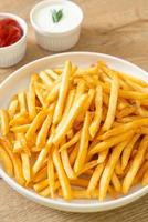 French fries with sour cream and ketchup photo