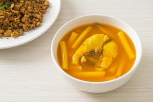 Sour soup with lotus stem and fish photo