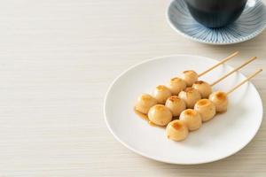 Mitarashi dango. Dumpling in a sweet soy sauce photo