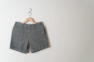 short pants hanging on wall photo