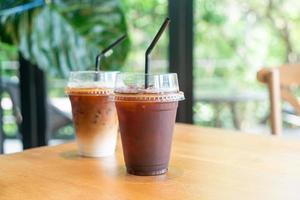 iced black coffee takeaway glass on table in coffee shop cafe restaurant photo