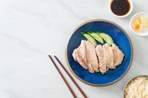 Hainanese chicken rice or rice steamed with chicken soup photo