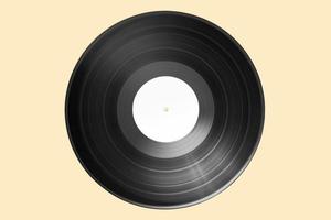 Vinyl record with bank label isolated on beige background. Mock up