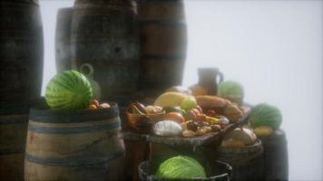 food table with wine barrels and some fruits, vegetables and bread video