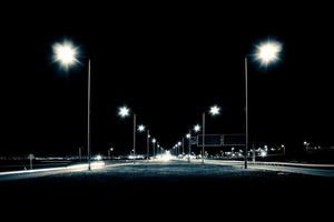 Empty freeway at night in blue monochrome. photo