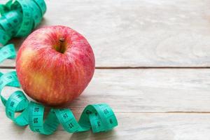 Healthy lifestyle concept with red apple. Weight loss or diet concept