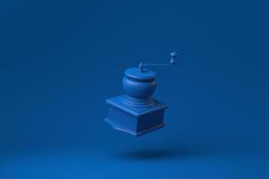 Blue Manual coffee grinder floating in blue background. minimal concept idea creative. monochrome. 3D render. photo