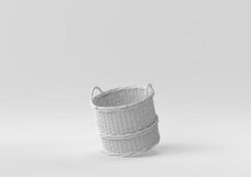 White wicker basket floating in white background. minimal concept idea creative. monochrome. 3D render. photo