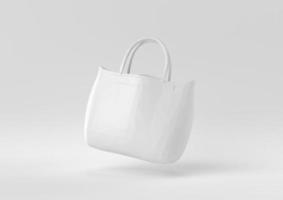 bolso blanco mujer accesorios de moda flotando en fondo blanco. idea de concepto mínimo creativo. estilo origami. procesamiento 3d foto