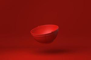 recipiente rojo de acero inoxidable flotando en un fondo rojo. idea de concepto mínimo creativo. monocromo. procesamiento 3d foto