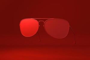 Red Glasses floating in red background. minimal concept idea creative. monochrome. 3D render. photo