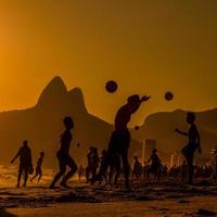 Bathers play ball on Ipenema beach in the city of Rio de Janeiro, Brazil.