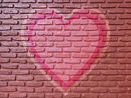 old brick wall graffiti heart, valentines day background photo