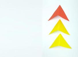 Paper arrow, concept of leadership and success. business concept. on a white background. new idea, courage, new thinking, creative solution photo