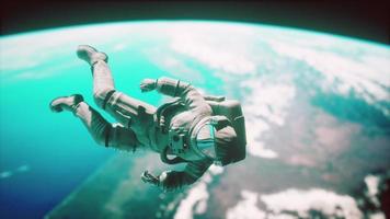 Astronaut floating above the Earth Elements of this image furnished by NASA photo