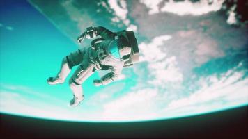 Astronaut floating above the Earth Elements of this image furnished by NASA photo