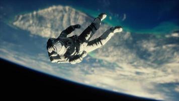 Astronaut floating above the Earth Elements of this image furnished by NASA photo