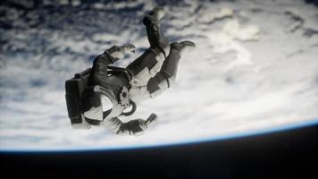 Astronaut floating above the Earth Elements of this image furnished by NASA photo