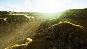 Landscape with mountains and dry yellow grass in New Zealand photo