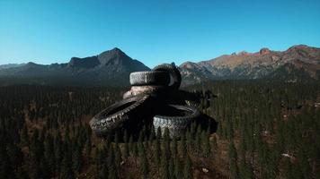 concept of environmental pollution with big old tires in mountain forest video