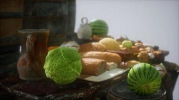 food table with wine barrels and some fruits, vegetables and bread video