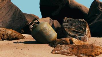 old cooking gas cylinder on sand beach video