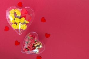 Transparent heart with yellow and burgundy roses in low poly style isolated on red background. Valentines day and mothers day concept  copy space photo