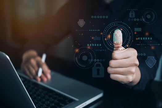 Woman using thumb to scan finger print with virtual guard and key for access biometric data by input password or fingerprint scanner for access security system , Futuristic technology concept. photo