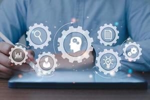 Businessman using on digital Tablet computer in office with virtual interface icons network diagram and digital marketing, Financial and banking, Digital link tech, big data. photo