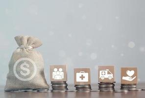 Money coin and wood block stacking with icon healthcare medical, Insurance for your health concept photo