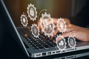 Businesswoman using a computer to Block Chain Industry 4.0 Technology. Worker touched blockchain microchip circuit icon on virtual screen. Blockchain Industrial Strategy Concept. photo