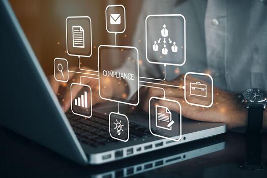 Businessman using a computer to document Compliance to Standards, Concept about conformity with manager or auditor pressing buttons with icons. photo