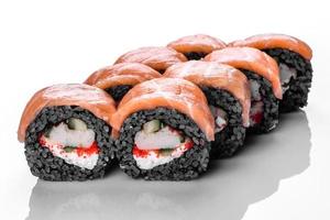 Traditional delicious fresh sushi roll set on a white background photo