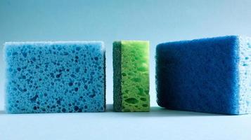 Many blue, red, yellow, green sponges are used to wash and wipe the dirt used by housewives in everyday life. They are made of porous material such as foam. good detergent retention photo