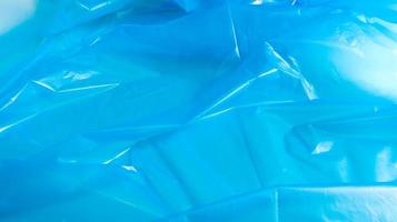 Blue plastic bag texture and background. A bag that is designed to accommodate garbage in it and is used at home and placed in various garbage containers. photo