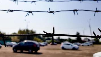 Cars behind a mesh fence. Security, guarded parking, fine, arrest concept photo