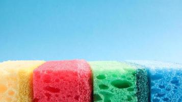 Many blue, red, yellow, green sponges are used to wash and wipe the dirt used by housewives in everyday life. They are made of porous material such as foam. good detergent retention photo