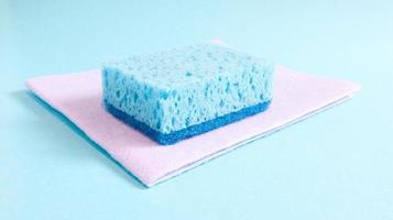 One blue sponge used to wash and erase dirt used by housewives in everyday life. They are made of porous material such as foam. Detergent retention, which allows you to spend it economically photo