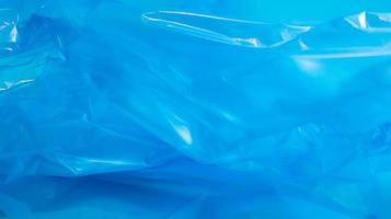 Blue plastic bag texture and background. A bag that is designed to accommodate garbage in it and is used at home and placed in various garbage containers. photo
