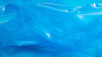 Blue plastic bag texture and background. A bag that is designed to accommodate garbage in it and is used at home and placed in various garbage containers. photo