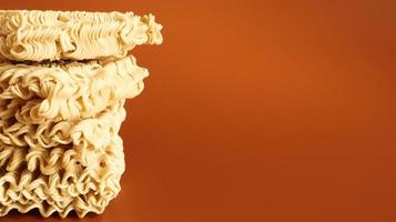 Raw dried instant noodles on a brown background. pasta, for the preparation of which it is enough to pour boiling water and wait a few minutes. Copy space. Vermicelli, spaghetti. photo