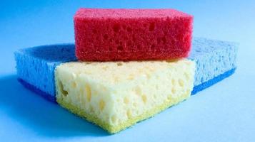 Many blue, red, yellow, green sponges are used to wash and wipe the dirt used by housewives in everyday life. They are made of porous material such as foam. good detergent retention photo