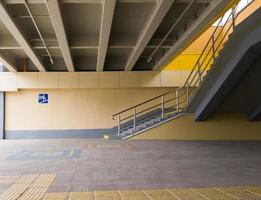 Ukraine, Kiev - September 26, 2019. The sign is an underground pedestrian crossing at the entrance to the underground passage. Empty yellow underground pedestrian crossing. photo