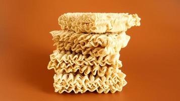 Raw dried instant noodles on a brown background. pasta, for the preparation of which it is enough to pour boiling water and wait a few minutes. Copy space. Vermicelli, spaghetti. photo