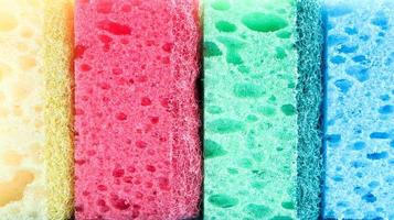 Many blue, red, yellow, green sponges are used to wash and wipe the dirt used by housewives in everyday life. They are made of porous material such as foam. good detergent retention photo