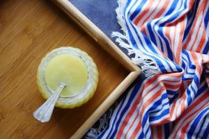 homemade ghee in container on a table , photo