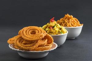 Indian Snack Chakli, chakali or Murukku and Besan Gram flour Sev and chivada or chiwada. Diwali Food photo