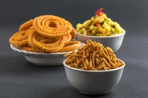 Indian Snack Chakli, chakali or Murukku and Besan Gram flour Sev and chivada or chiwada. Diwali Food photo