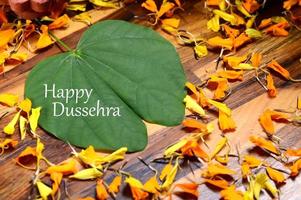 Indian Festival Dussehra, showing golden leaf . Greeting card. photo